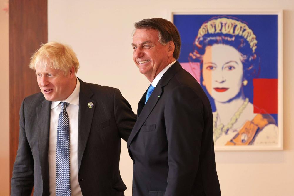 O primeiro-ministro do Reino Unido, Boris Johnson, e o presidente do Brasil, Jair Bolsonaro - Michael M. Santiago-Pool/AFP